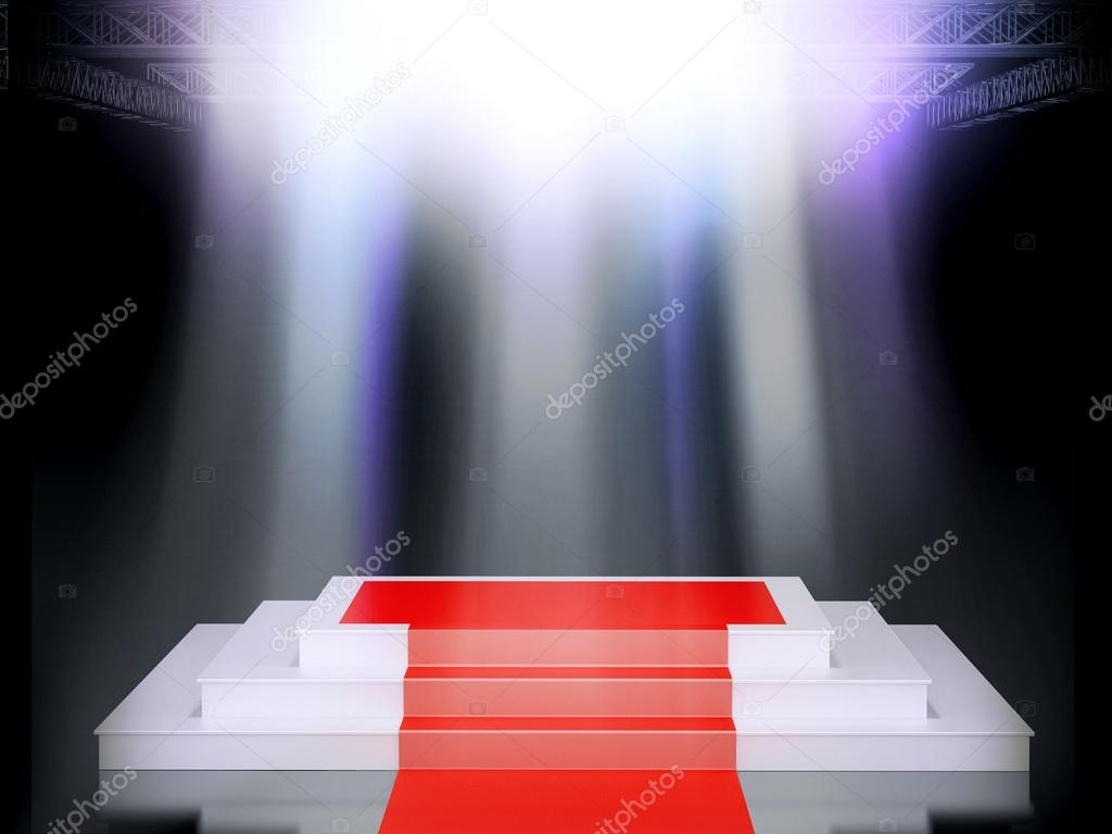 Illuminated empty stage podium with red carpet for award ceremony