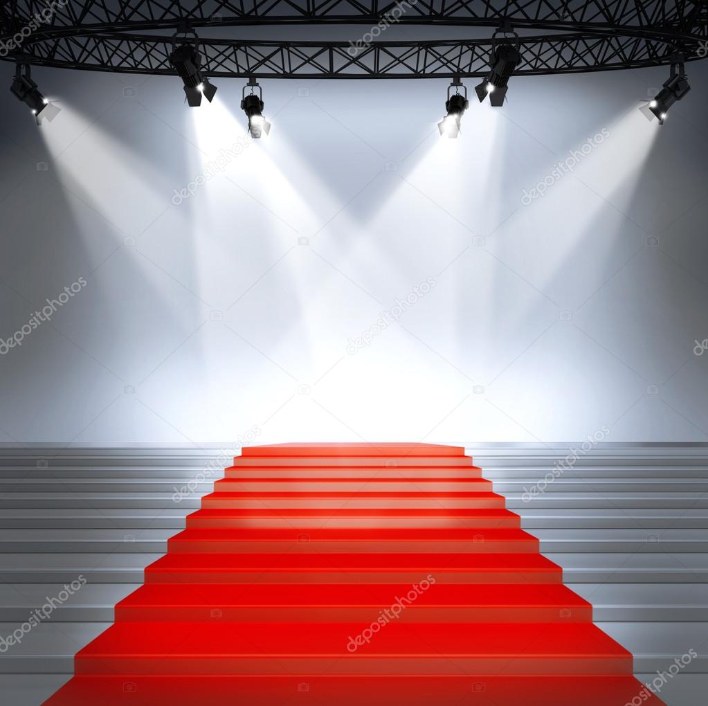 Illuminated empty stage podium with red carpet for award ceremony