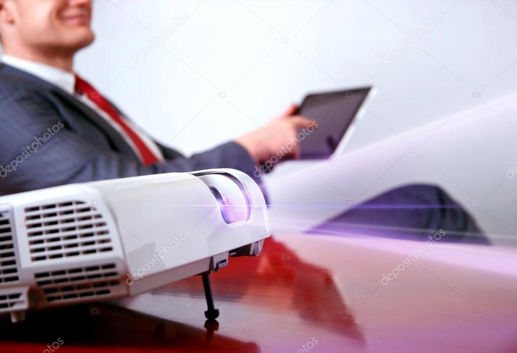 Businessman with projector