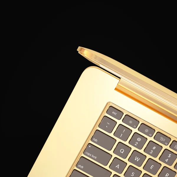 Złoty laptopa na czarnym tle — Zdjęcie stockowe