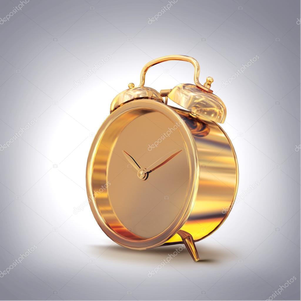 Golden old fashioned  alarm clock on grey  background.