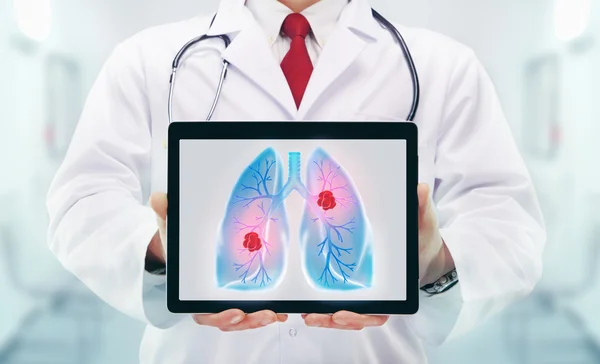 Doctor with stethoscope and tablet in a hospital — Stock Photo, Image