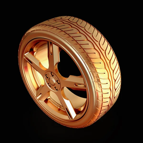 Golden tire on black isolated background. — Stok fotoğraf