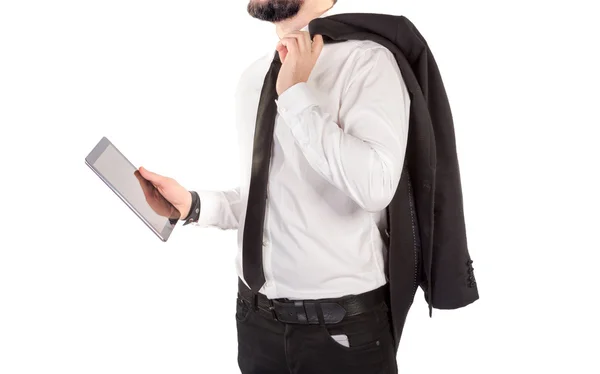 Hipster hombre en un traje clásico aislado sobre un fondo blanco con una tableta en la mano . —  Fotos de Stock