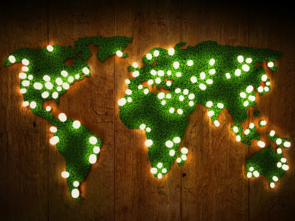 Wereld kaart achtergrond met een grasveld en hout met gloeiende lichten. — Stockfoto