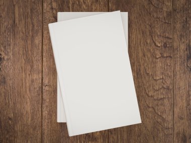 Empty white book mockup template on wood background clipart