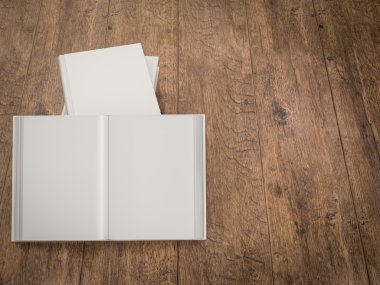 Ahşap arka plan boş beyaz kitabın mockup şablonu