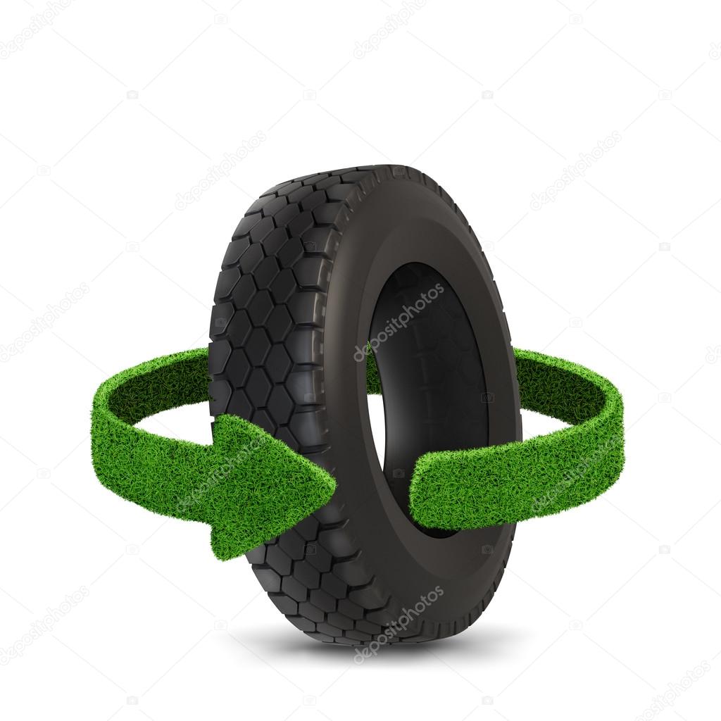 Car tyre. Concept with green arrows from the grass. Recycling concept