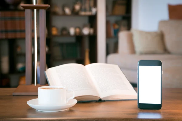 Open boek, mobiele telefoon en cup met koffie over houten tafel, retro gefilterde afbeelding — Stockfoto