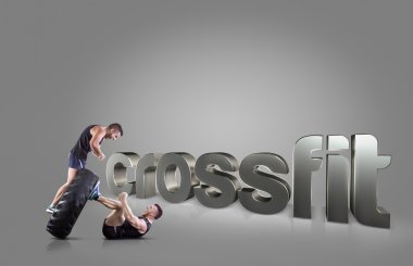 Atletik genç insanlar bir lastik gri arka plan motivasyonel fitness öbekleri üzerinde kaldırma