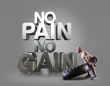 Atletik genç adam gri arka plan motivasyonel fitness öbekleri üzerinde lastik kaldırma