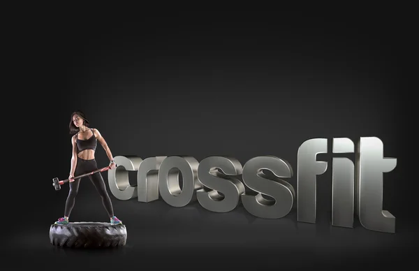 Femeia sport care deține un ciocan pe fundal Expresii motivaționale de fitness — Fotografie, imagine de stoc