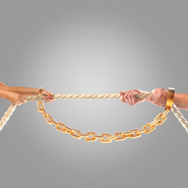 Hands girls and adult men pulling the rope in chains on a gray background.  Competition concept clipart