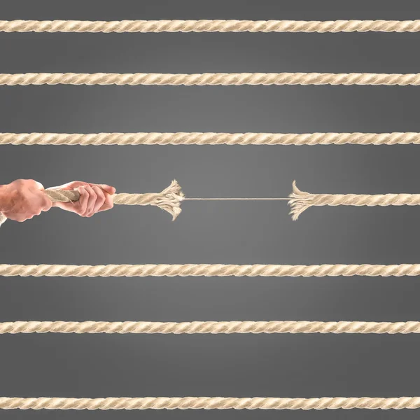 Hands of people pulling the rope on black background. Competition concept — Stock Photo, Image