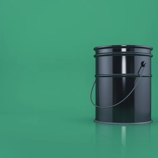 Black bucket on a green background  front view with space for text — Stock Photo, Image