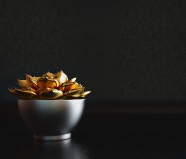 İçinde altın bitki siyah bir arka plan üzerinde siyah dekoratif pot