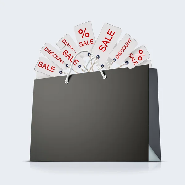 Back strong paper shopping bag with lot of tags on white background — Stock Photo, Image