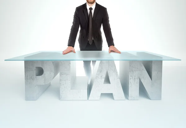 Confident business man leaning on PLAN table. Bussines concept — Stockfoto