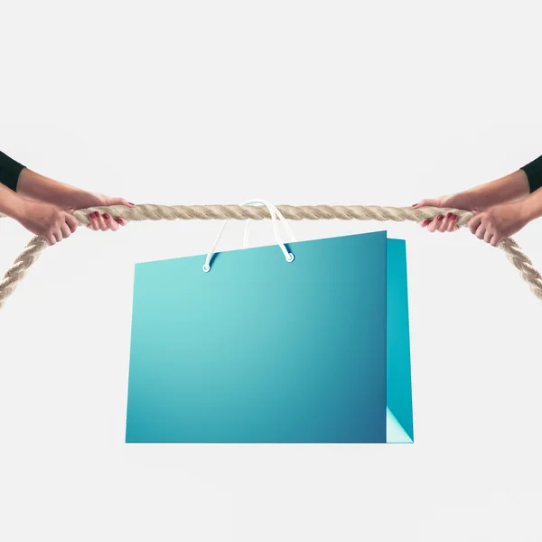 Hands of people pulling the rope on white background. Shopping concept — Stockfoto