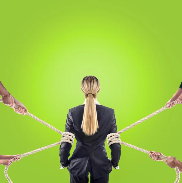 Hands of people pulling the rope on color background. Search employee concept — Stock Photo, Image