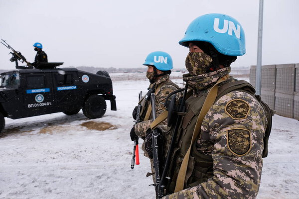 Almaty / Kazakhstan - 11.20.2020 : Soldiers guard the UN base. Conducting peacekeeping exercises in snowfall.