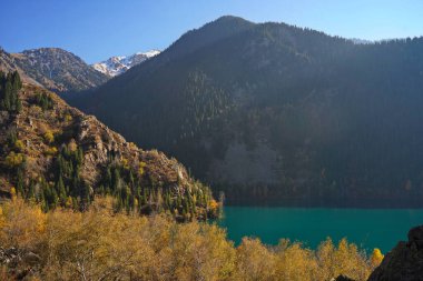 Lake Issyk in the rays of the setting sun. National Nature Park.
