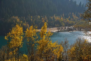 Lake Issyk in the rays of the setting sun. National Nature Park.