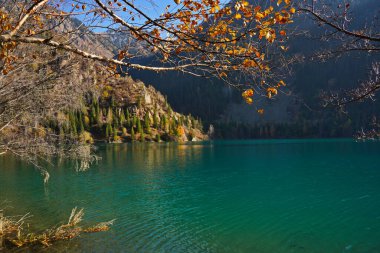 Lake Issyk in the rays of the setting sun. National Nature Park.