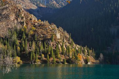 Lake Issyk in the rays of the setting sun. National Nature Park.