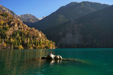 Lake Issyk in the rays of the setting sun. National Nature Park.
