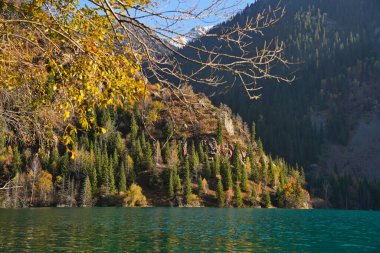 Lake Issyk in the rays of the setting sun. National Nature Park.
