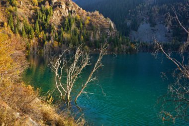 Lake Issyk in the rays of the setting sun. National Nature Park.