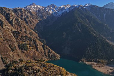 Lake Issyk in the rays of the setting sun. National Nature Park.