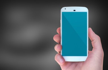 Modern mobile smart phone in male hand with black bokeh style background