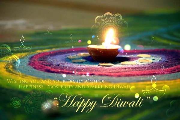 Diwali diya на красочных ранголи — стоковое фото