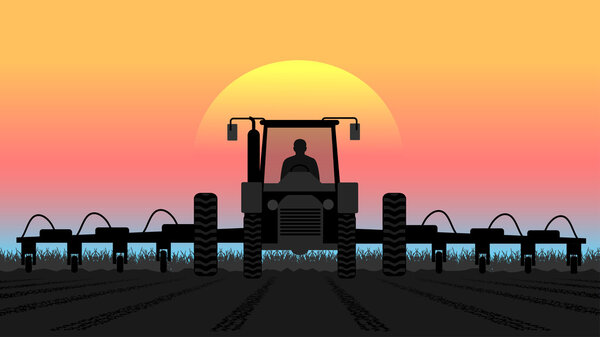Трактор обрабатывает землю сельским пейзажем
