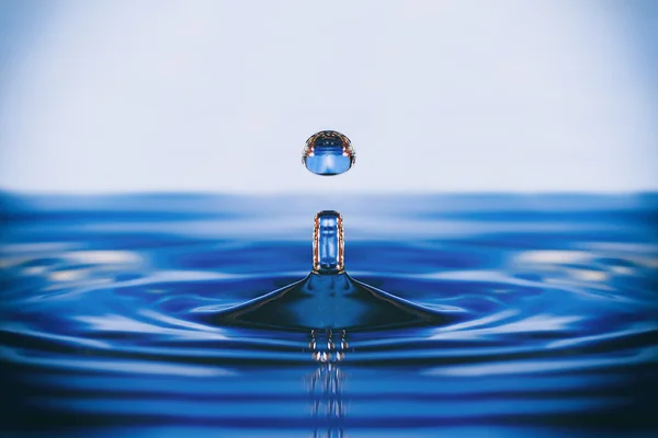 Falling into water droplets — Stock Photo, Image