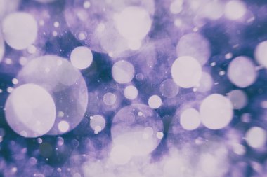 Festival arka plan. Glitter vintage ışıklar arka ışıklı defocused.