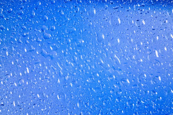 Gotas de lluvia en la ventana. gotas de lluvia de agua en ventana de vidrio —  Fotos de Stock