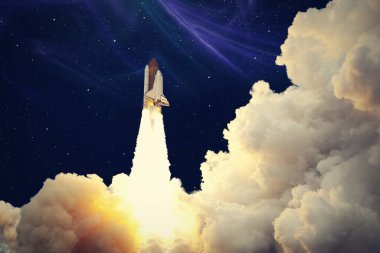 Roketler yıldızlı gökyüzünde uzaya fırlatılıyor. Roket uzay kavramına başlıyor. NASA tarafından desteklenen bu görüntünün elementleri