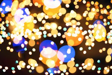 Doğal Bokeh ve parlak altın ışık şenlikli arka plan. Vintage sihirli arka plan rengi ile