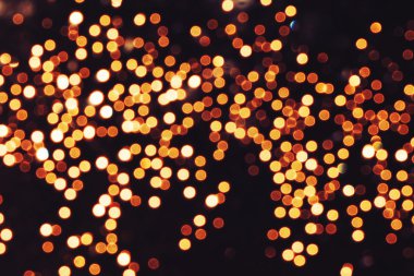 Doğal Bokeh ve parlak altın ışık şenlikli arka plan. Vintage sihirli arka plan rengi ile