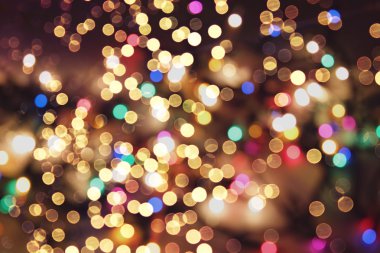 Bokeh ışıkları ve yıldız desenli şenlikli soyut arkaplan