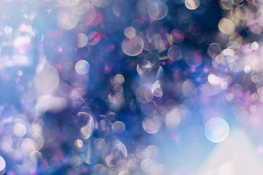 Bokeh ışıkları ve yıldız desenli şenlikli soyut arkaplan