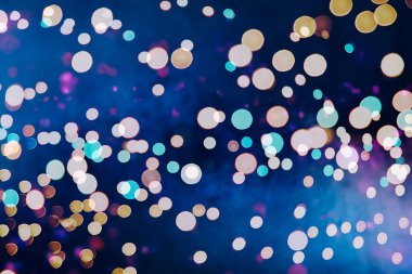 Bokeh ışıkları ve yıldız desenli şenlikli soyut arkaplan