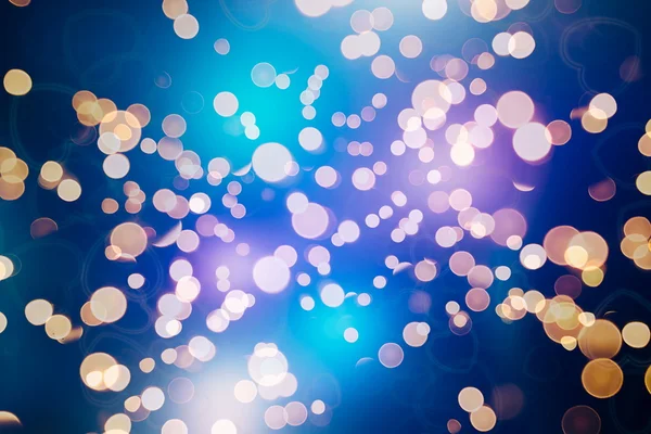 Bokeh ışıkları ve yıldız desenli şenlikli soyut arkaplan