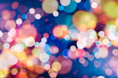 Bokeh ışıkları ve yıldız desenli şenlikli soyut arkaplan