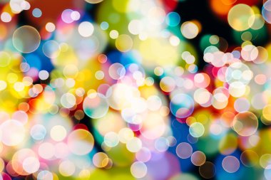 Bokeh ışıkları ve yıldız desenli şenlikli soyut arkaplan