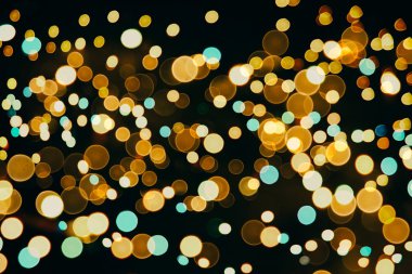 Bokeh ışıkları ve yıldız desenli şenlikli soyut arkaplan