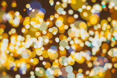 Bokeh ışıkları ve yıldız desenli şenlikli soyut arkaplan